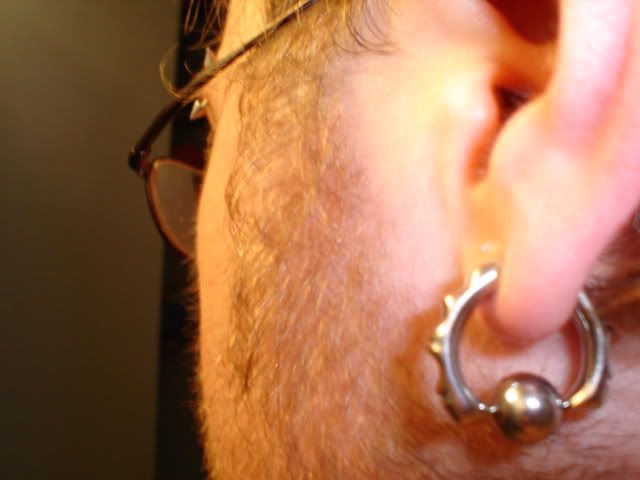 10 gauge ear piercing. Pierced at 10 gauge,