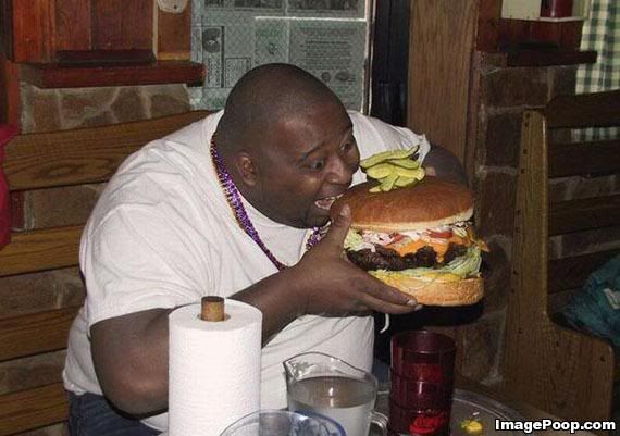 big_guy_eating_huge_cheeseburger.jpg